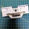Замок люка (убл) Korting 677120030013-2 для пмм