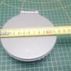 Панель сливного фильтра Haier 0020206591 ( серебро) к стиральной машине