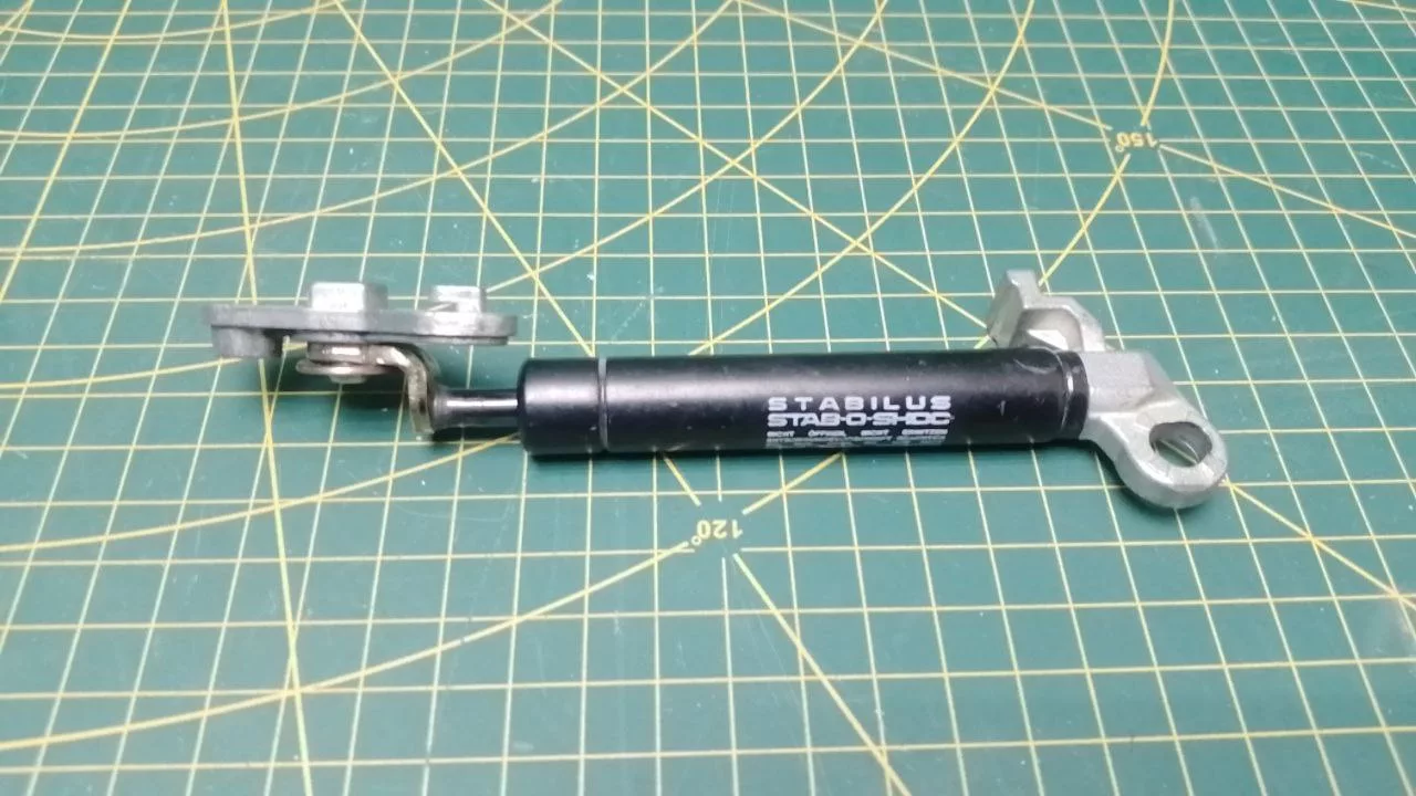 Амортизатор дверцы верхней крышки Miele 6139061 к стиральной машине
