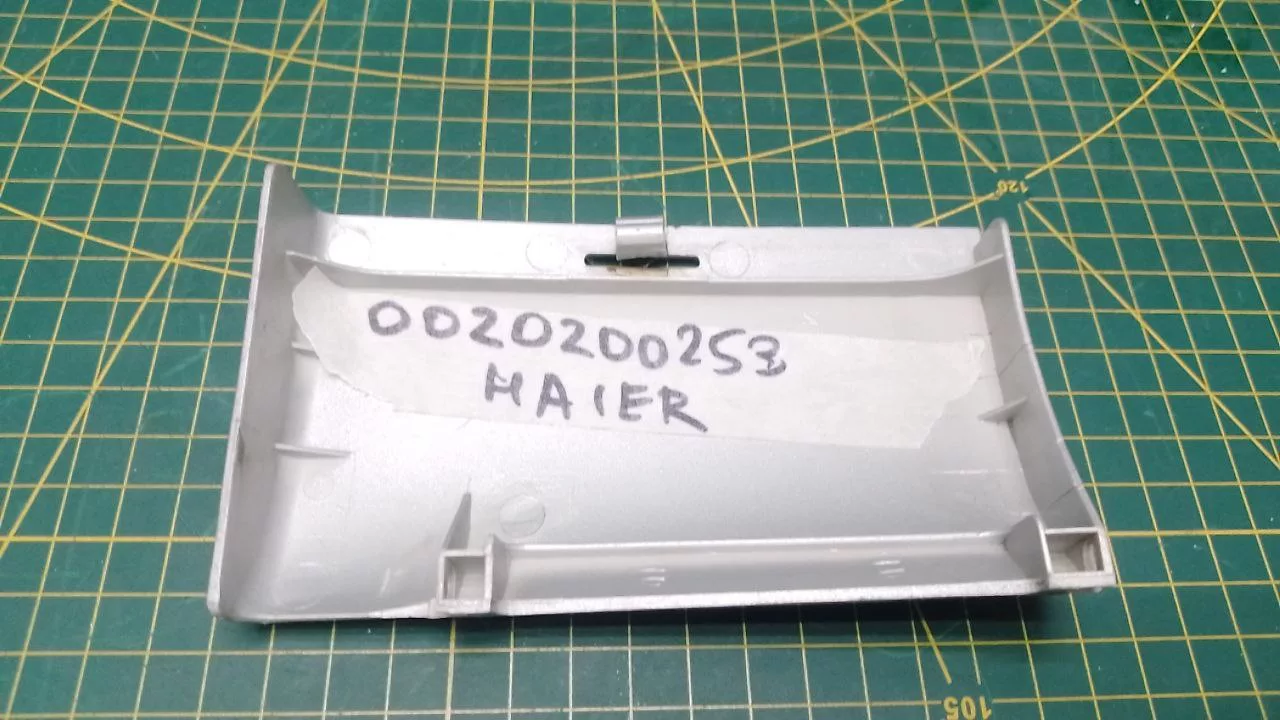 Панель сливного фильтра Haier 0020200253 к стиральной машине