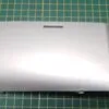 Панель сливного фильтра Haier 0020200253 к стиральной машине