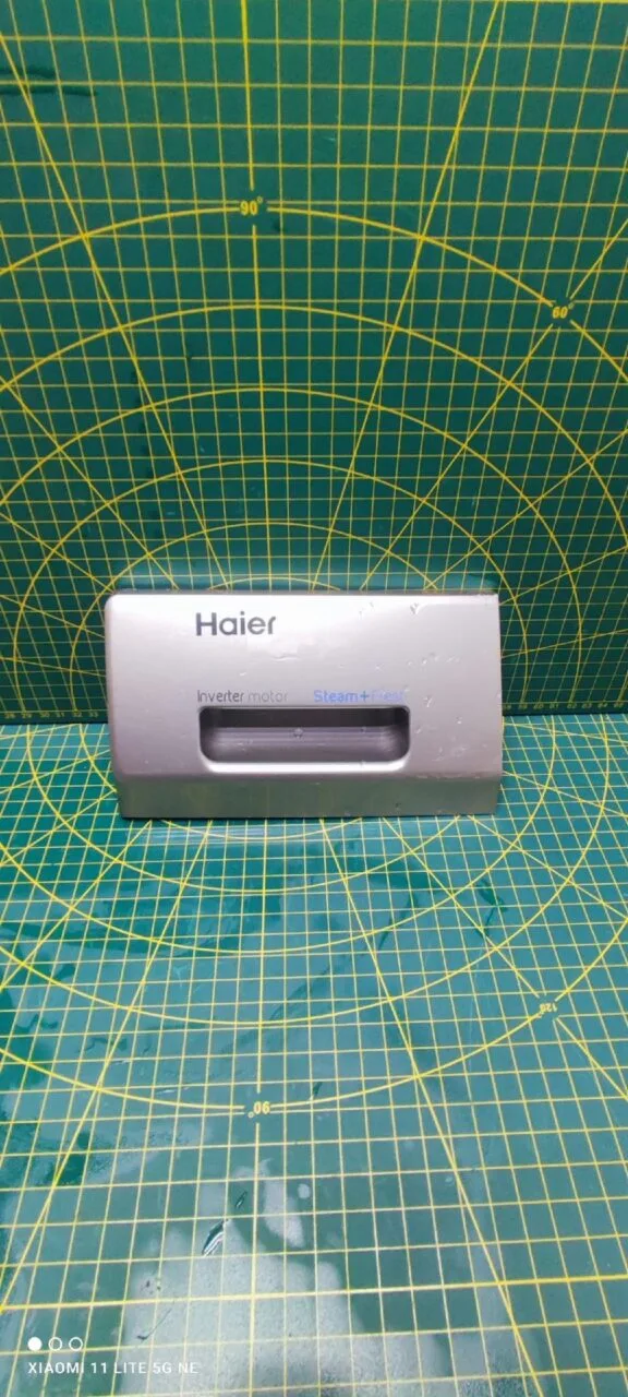 Панель порошкоприемника Haier 0020206875сер