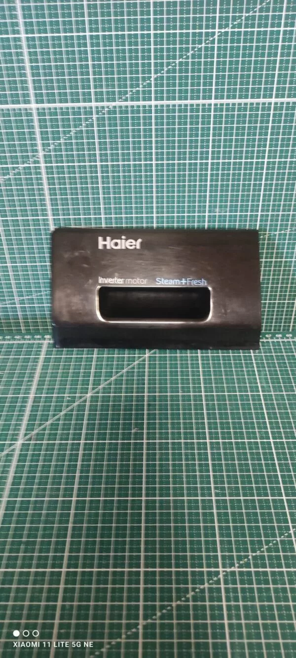 Панель порошкоприемника Haier 0020206875 черн.
